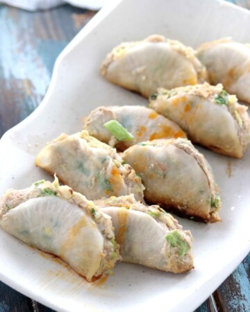 Japanese potstickers dipping sauce drizzled over healthy potstickers