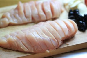 My PCOS Kitchen - Hasselback Chicken Caprese - A chicken breast sliced and stuffed with fresh mozzarella, pesto, tomatoes, basil and olives. Keto/low carb
