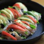 My PCOS Kitchen - Hasselback Chicken Caprese - A chicken breast sliced and stuffed with fresh mozzarella, pesto, tomatoes, basil and olives. Keto/low carb