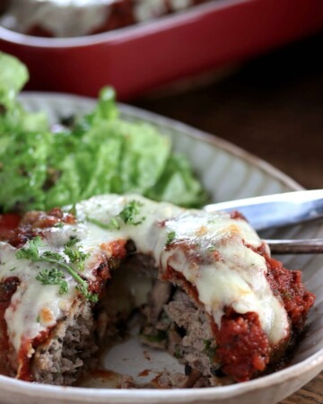 My PCOS Kitchen - Keto Cheese-Stuffed Giant Meatballs - These gluten-free and low carb mega meatballs are stuffed with gooey mozzarella cheese and topped with an herbed marinara sauce.