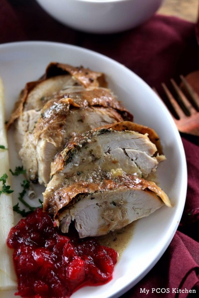 My PCOS Kitchen - Keto Thanksgiving Turkey - Cut up turkey breast with delicious gravy over the meat and a bit of low carb cranberry sauce.