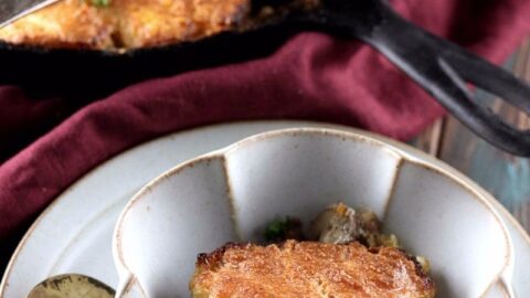 My PCOS Kitchen - Low Carb Sausage Gravy & Biscuits Skillet - A bowl full of biscuits and sausage gravy with a black lodge skillet filled with a biscuit casserole.