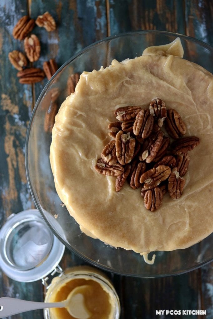 Sugar Free Cheesecake with Caramel - My PCOS Kitchen - Overhead shot of a caramel cheesecake topped with pecan nuts.