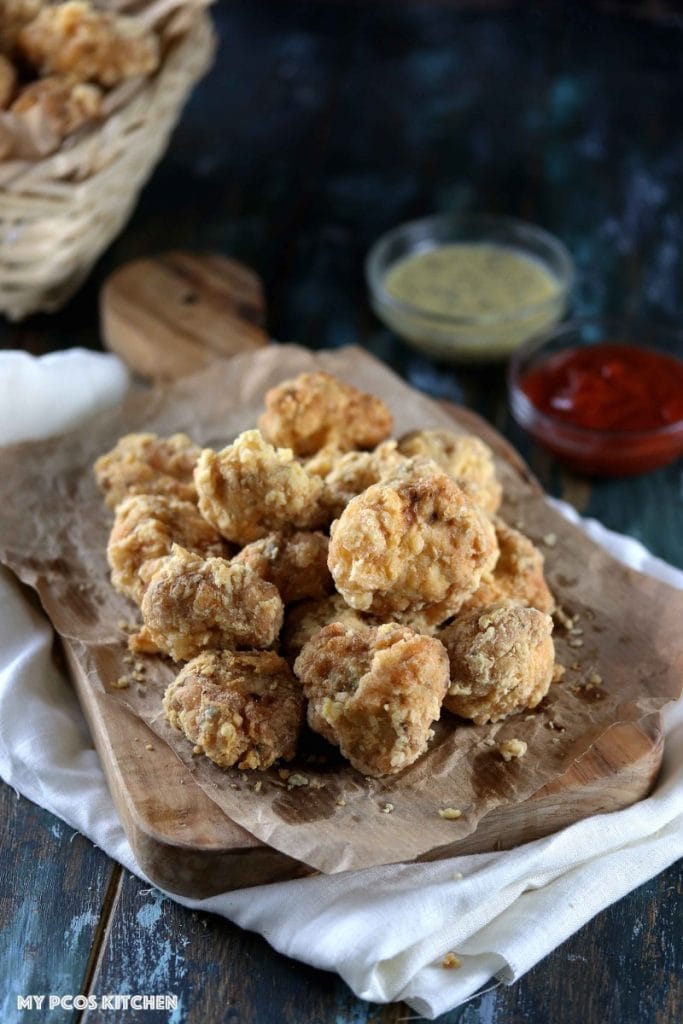 Gluten Free Chicken Nuggets - My PCOS Kitchen - Delicious gluten-free chicken nuggets coated with egg white powder. Sugar-free ketchup and mustard in the back.
