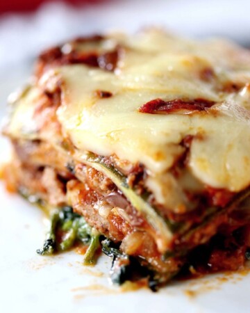 Low Carb Zucchini Lasagna - My PCOS Kitchen - A closeup shot of the zucchini noodles lasagna sheets. Meaty tomato sauce with cheese.