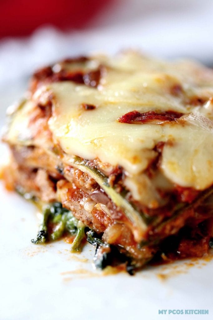Low Carb Lasagna with Zucchini Noodles - My PCOS Kitchen - A closeup shot of the zucchini noodles lasagna sheets. Meaty tomato sauce with cheese.