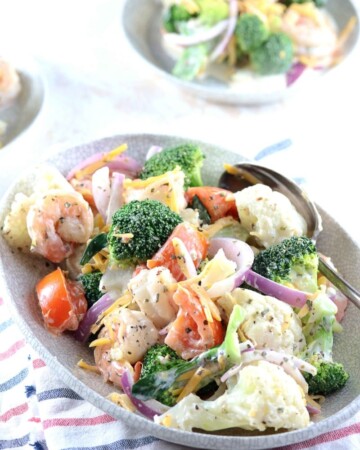 Amish Broccoli Cauliflower Salad with Shrimps - My PCOS Kitchen - A delicious creamy salad made with healthy vegetables and shrimp. Two small bowls of salad in the background.