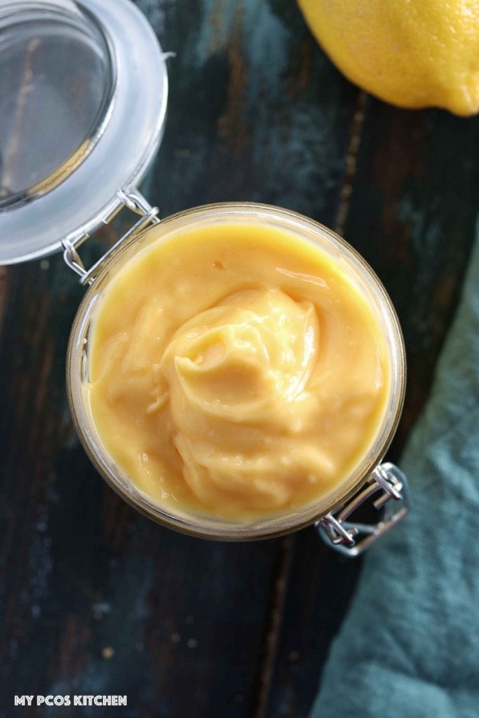 How to make a Lemon Curd - Low Carb Sugar Free Lemon Curd - My PCOS Kitchen - An overhead shot of sugar-free lemon curd in a glass jar.
