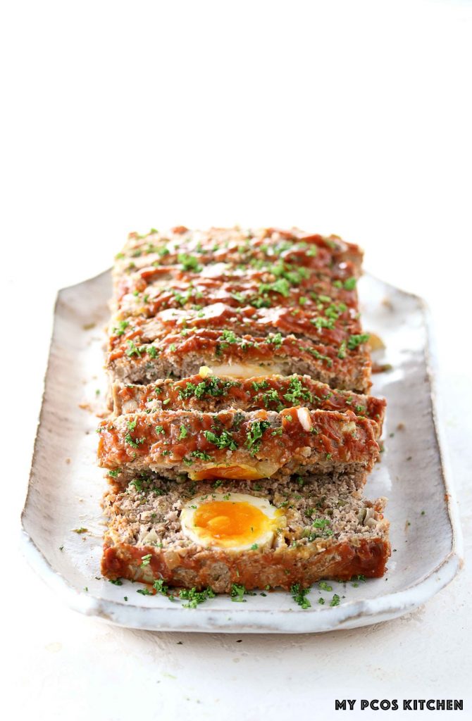 Keto Meatloaf with Eggs - My PCOS Kitchen - Slices of meatloaf covered in Heinz reduced sugar ketchup.