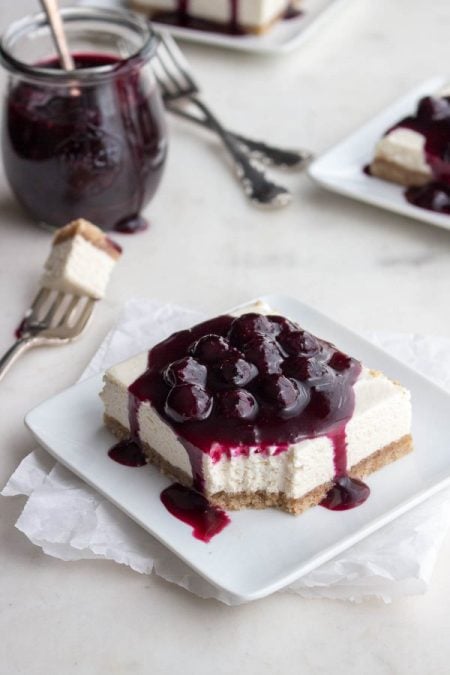 20+ Sugar Free Cheesecake Recipes - My PCOS Kitchen - Delicious Low Carb Cheesecake Recipes that have NO sugar and are all gluten-free! No Bake Cheesecake Bars with Blueberry Sauce - Low Carb Maven