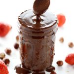 Sugar Free Nutella - My PCOS Kitchen - A white spoon is dipped in a jar full of sugar free chocolate hazelnut nutella spread.