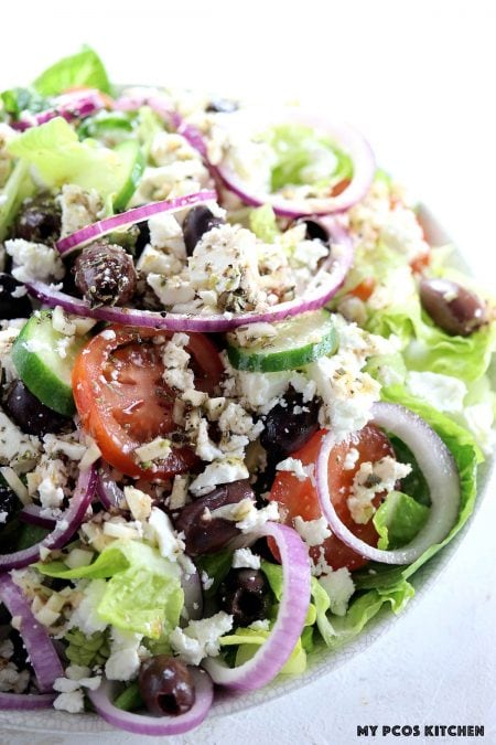 Authentic Greek Salad - My PCOS Kitchen - A traditional Greek salad dressing topped over the best greek salad recipe!