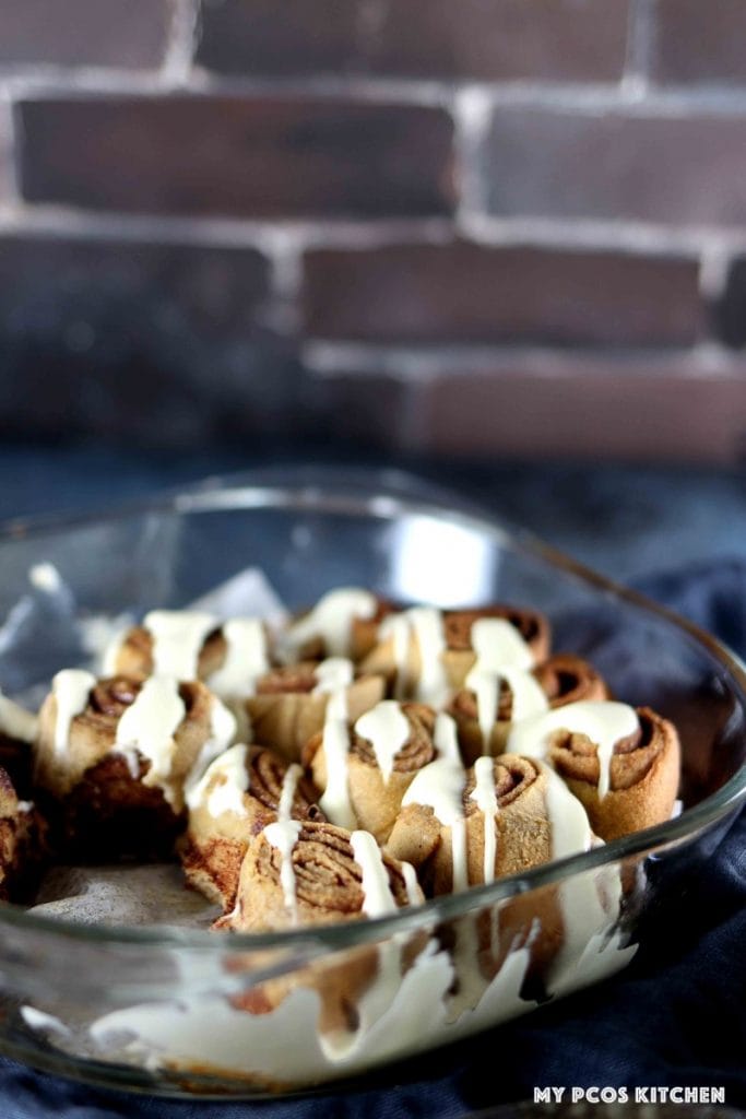 soft and chewy keto cinnamon rolls in a glass baking dish.
