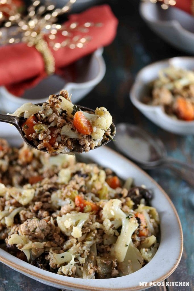 A spoonful of paleo cauliflower stuffing with sausage.