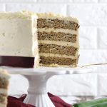 A cream cheese frosted four layer zucchini cake