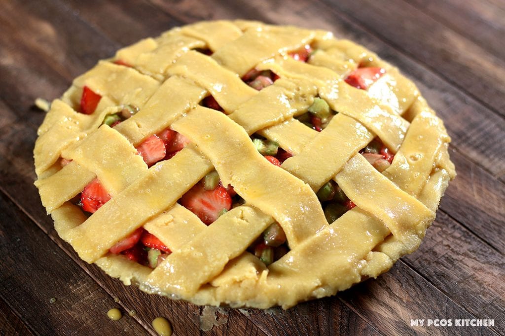 A simple egg wash over a cream cheese pie crust with a lattice design.
