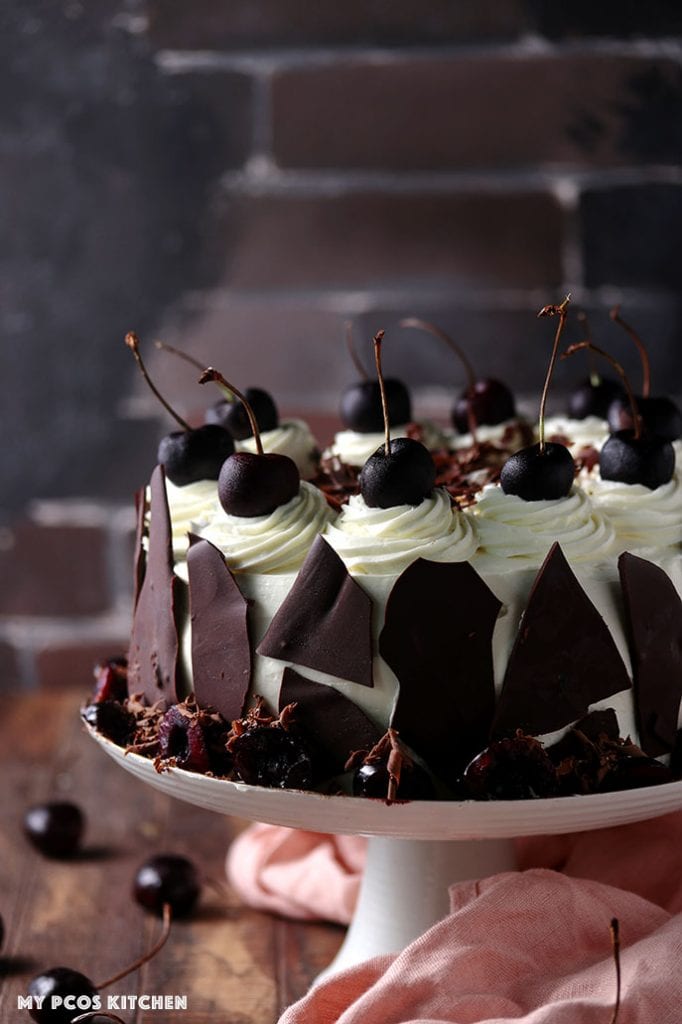 A low carb Black Forest Cake on a cake stand.
