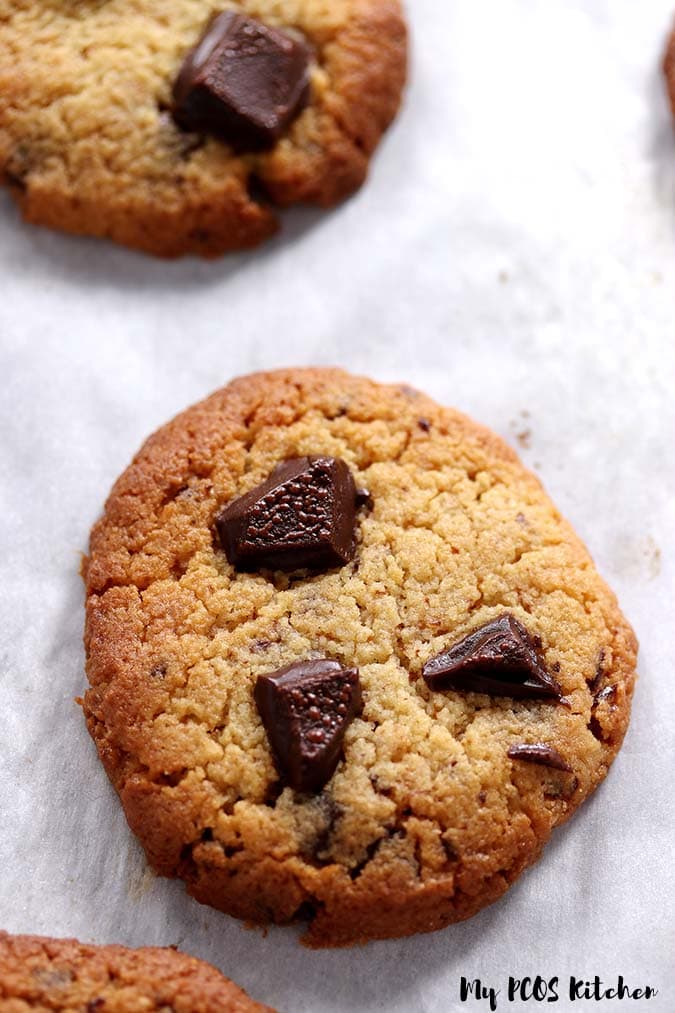 An low carb chocolate chip cookie made with allulose and almond flour topped with sugar free chocolate.