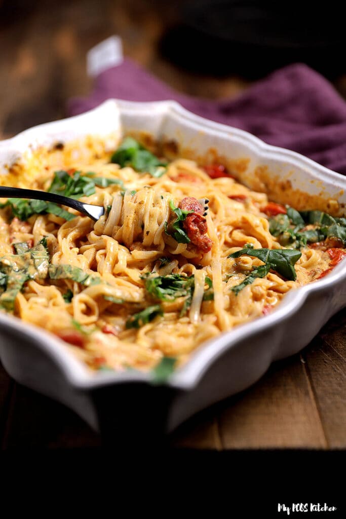 Baked feta pasta in a baking dish baked in an oven.